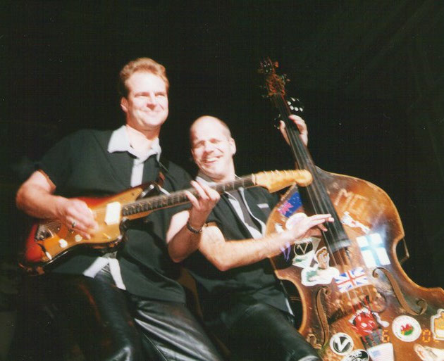 Two musicians performing on stage