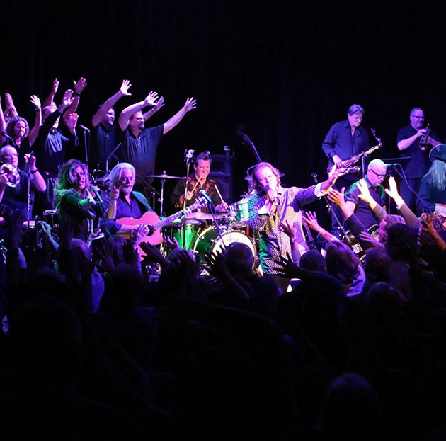 Large ensemble concert with crowd